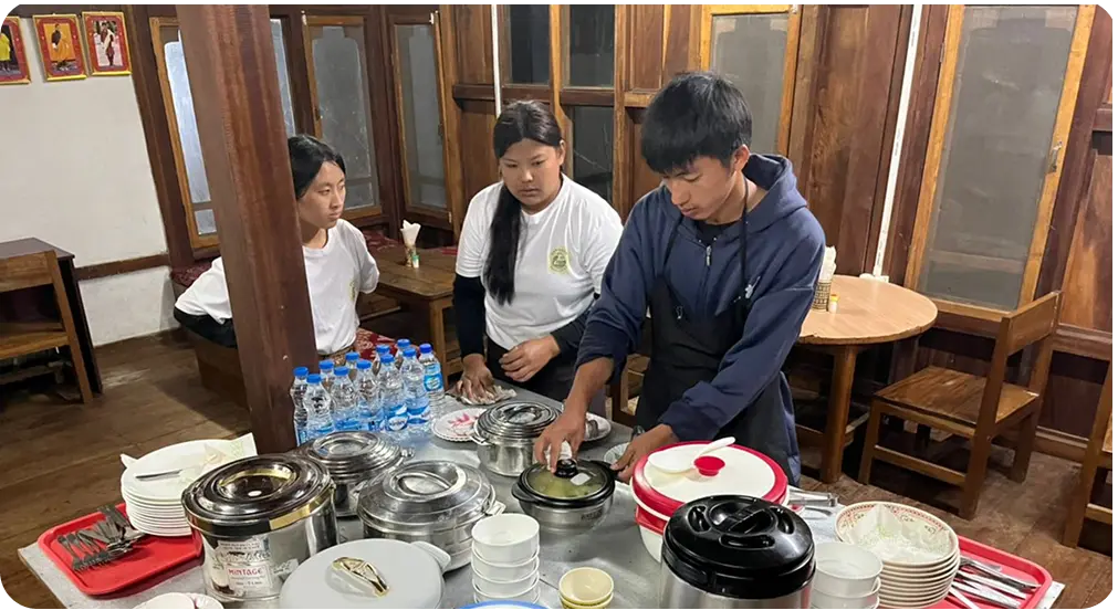 Local Panbang staff preparing traditional Bhutanese food